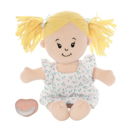 Plush toy doll sitting with blonde pigtails and a patterned dress