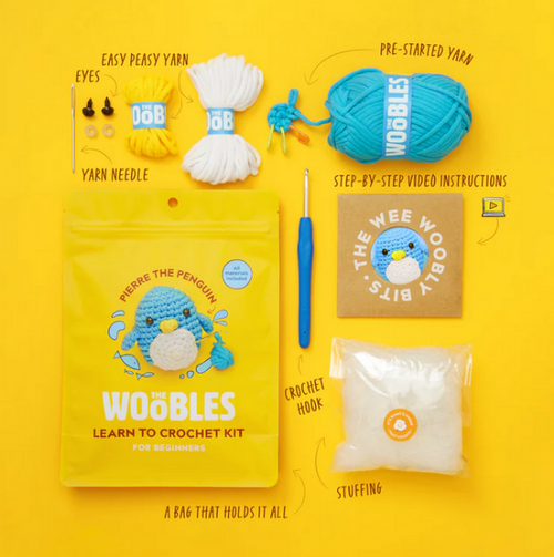 Crochet kit with yarn, needles, and a bag